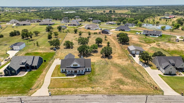 aerial view featuring a water view and a residential view