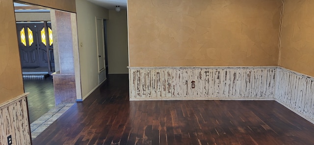 empty room featuring dark wood-type flooring