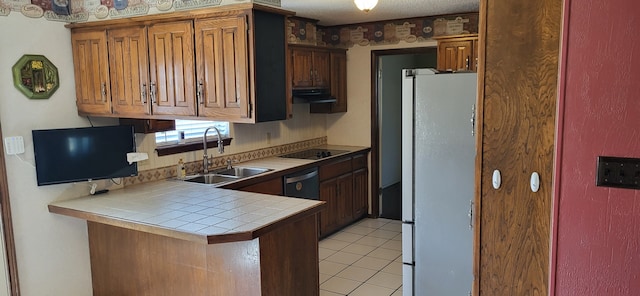 kitchen featuring range hood, light tile patterned flooring, a sink, a peninsula, and black appliances