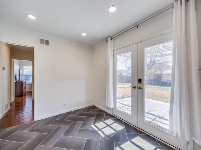 interior space featuring baseboards, visible vents, crown molding, french doors, and recessed lighting