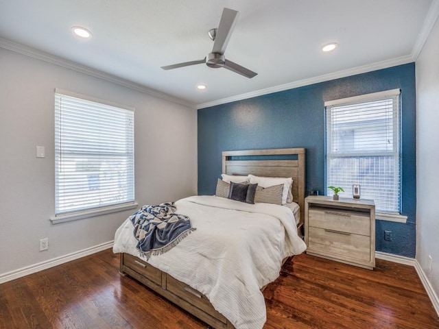 bedroom featuring dark wood-style flooring, crown molding, and baseboards
