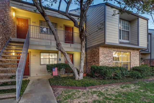 exterior space with brick siding