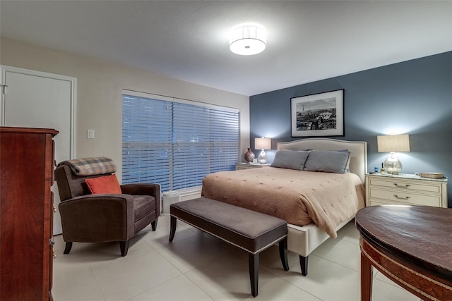 bedroom with light tile patterned floors