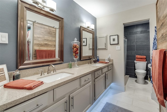 full bath with double vanity, tile patterned flooring, toilet, and a sink