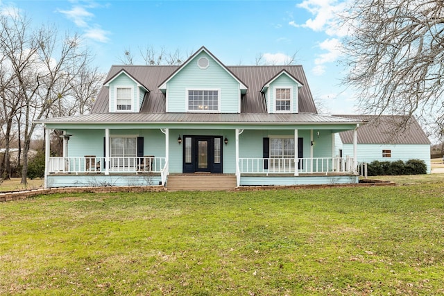 farmhouse with metal roof, a front lawn, and a porch