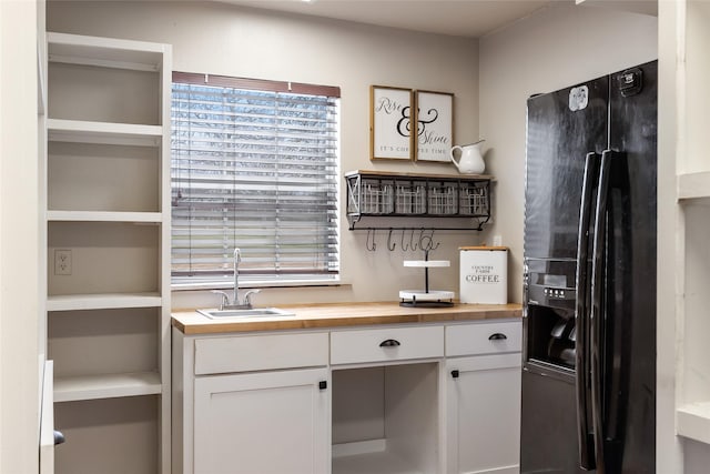 unfurnished office with a wealth of natural light and a sink