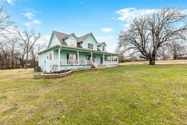 view of front of house featuring a porch, cooling unit, and a front lawn