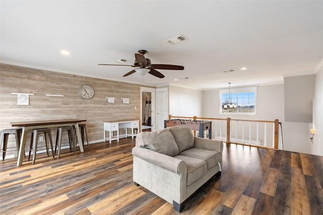 3147 US Highway 67, Sulphur Springs, TX 75482 - living room featuring ornamental molding, wood walls, wood finished floors, a ceiling fan, and recessed lighting