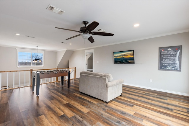 game room featuring crown molding, recessed lighting, visible vents, dark wood-type flooring, and baseboards