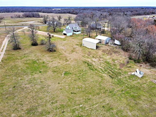 birds eye view of property featuring a rural view