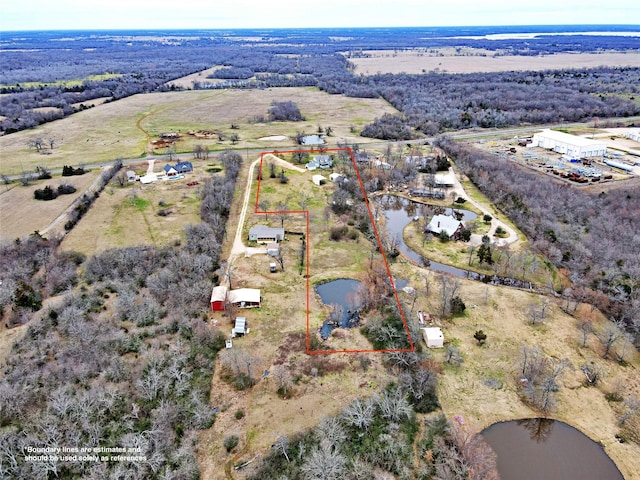 birds eye view of property with a water view and a rural view