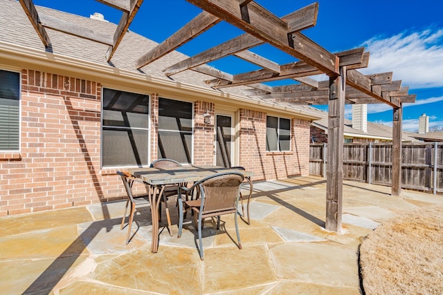 view of patio / terrace with fence, outdoor dining area, and a pergola