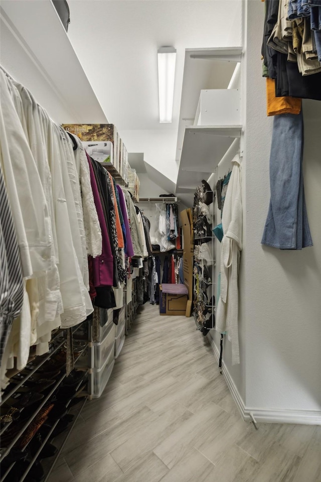 spacious closet with wood finished floors