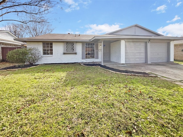 single story home featuring an attached garage, driveway, a front yard, and brick siding