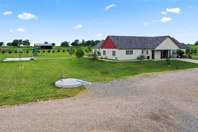 exterior space with driveway and a front lawn