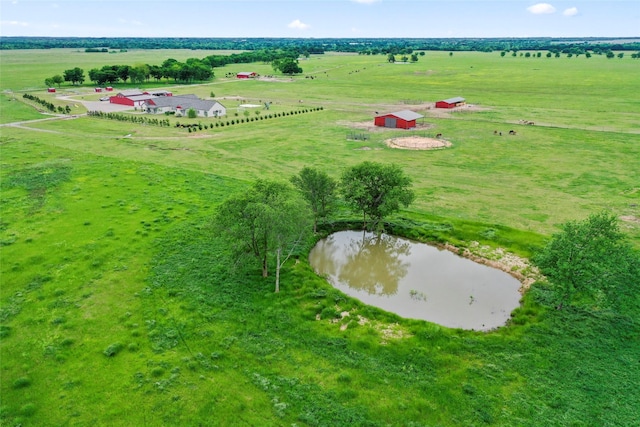 aerial view with a rural view and a water view