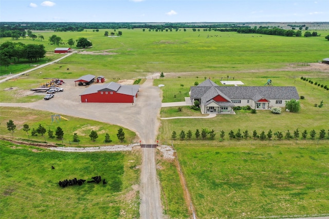 birds eye view of property featuring a rural view