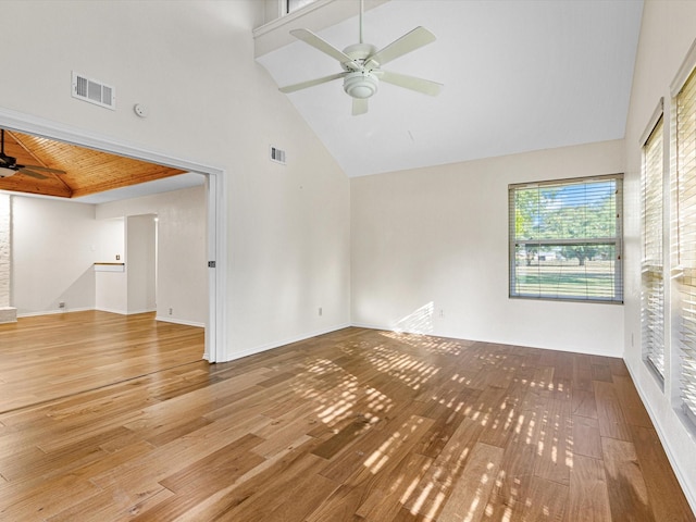 unfurnished room featuring high vaulted ceiling, visible vents, ceiling fan, and wood finished floors