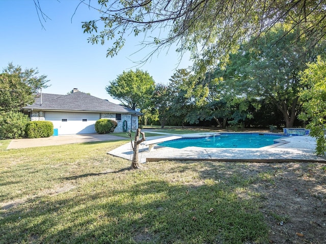 pool featuring a yard and a diving board