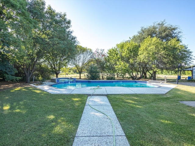 view of swimming pool featuring a yard and a pool with connected hot tub