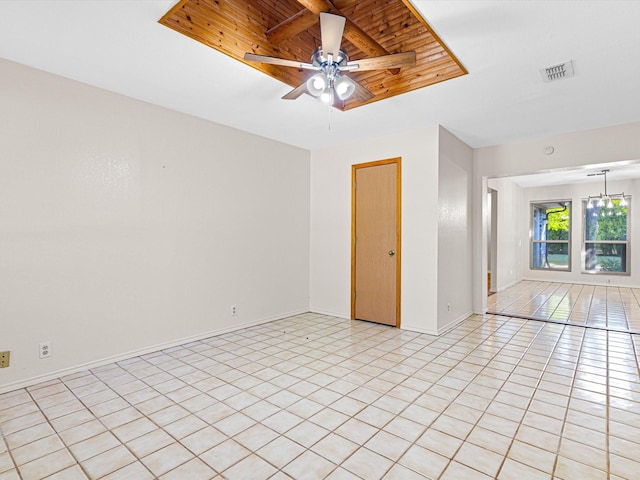 empty room featuring visible vents, a ceiling fan, light tile patterned flooring, wooden ceiling, and baseboards