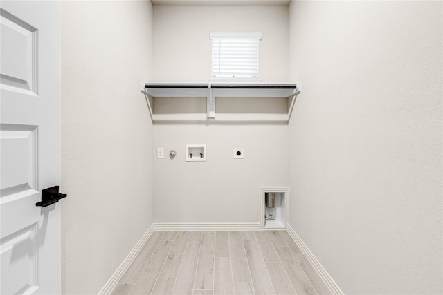 laundry room featuring gas dryer hookup, hookup for a washing machine, laundry area, light wood-type flooring, and electric dryer hookup