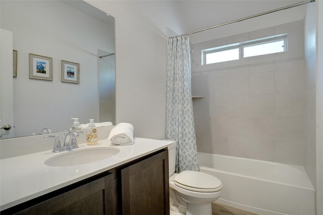 bathroom featuring toilet, vanity, and shower / tub combo with curtain