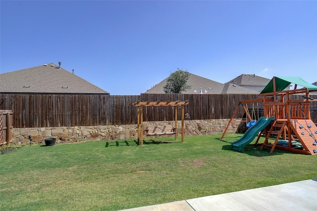 view of yard with a fenced backyard and a playground