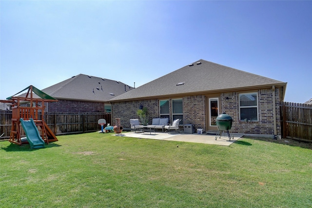 back of house with a fenced backyard, an outdoor living space, a playground, and a patio