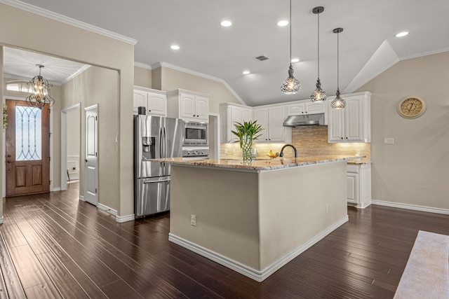 kitchen with under cabinet range hood, white cabinetry, stainless steel appliances, and pendant lighting