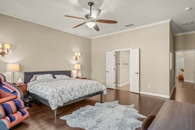 bedroom with ornamental molding, visible vents, dark wood finished floors, and baseboards