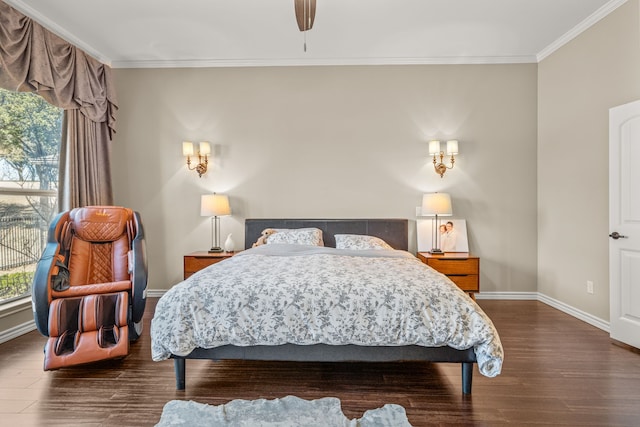 bedroom with dark wood-type flooring, crown molding, baseboards, and ceiling fan