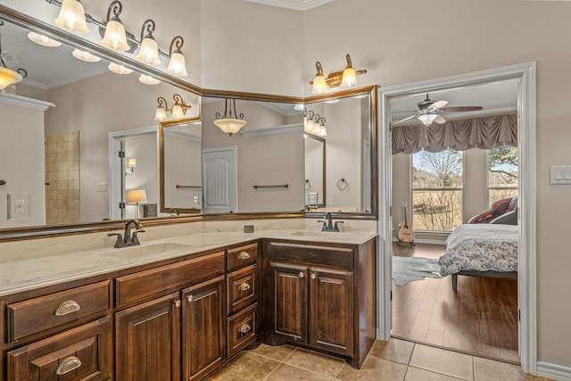 full bath with crown molding, a ceiling fan, a sink, and ensuite bathroom