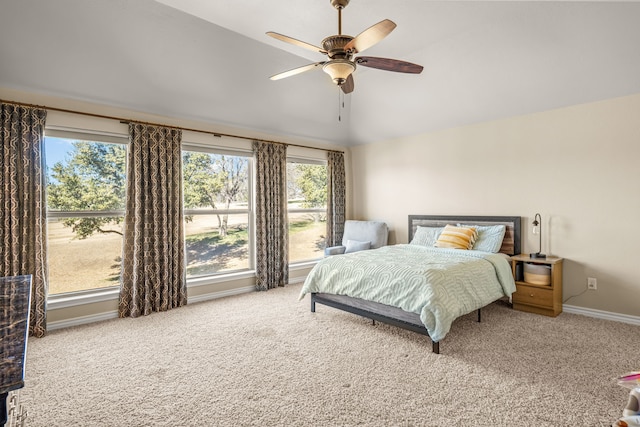 bedroom featuring lofted ceiling, ceiling fan, carpet, and baseboards