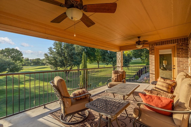 view of patio / terrace featuring a balcony and ceiling fan