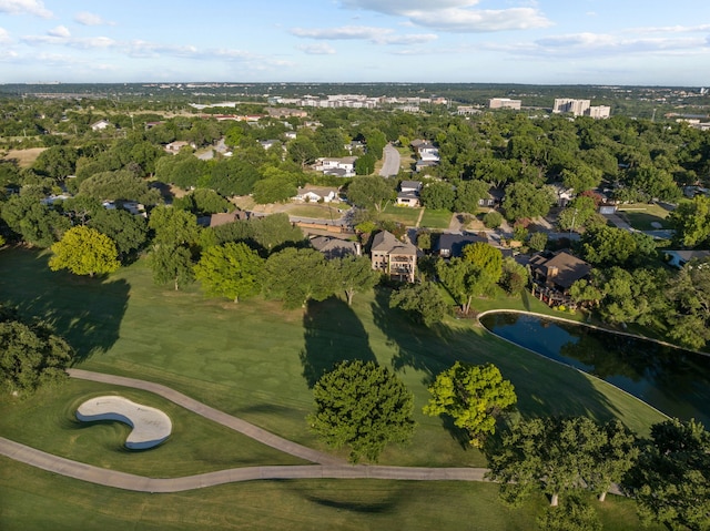 aerial view featuring golf course view and a water view