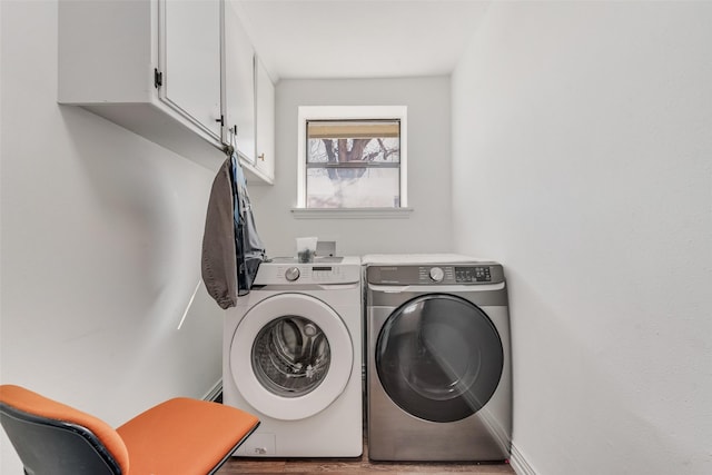 laundry area with cabinet space and washer and clothes dryer