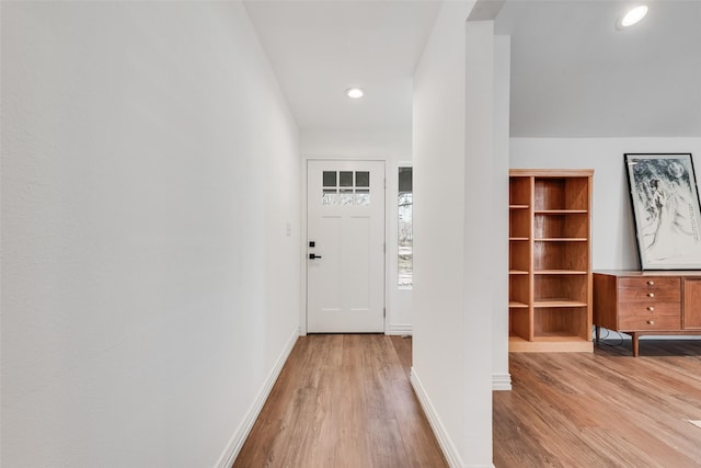 interior space featuring recessed lighting, light wood-type flooring, and baseboards