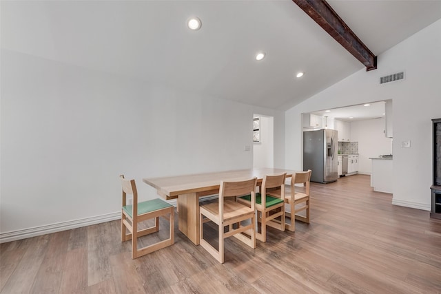 dining room with vaulted ceiling with beams, light wood finished floors, visible vents, and recessed lighting