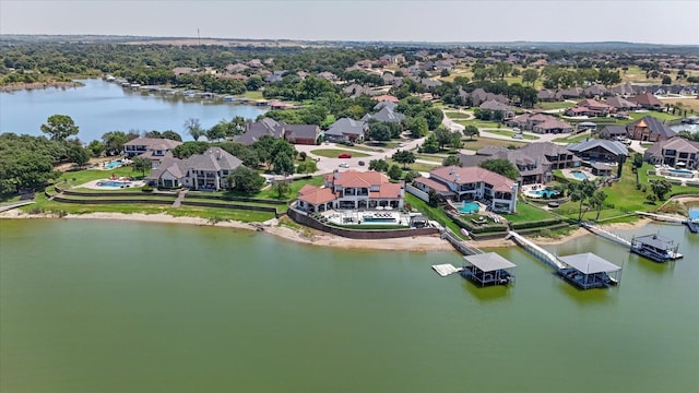 birds eye view of property featuring a residential view and a water view