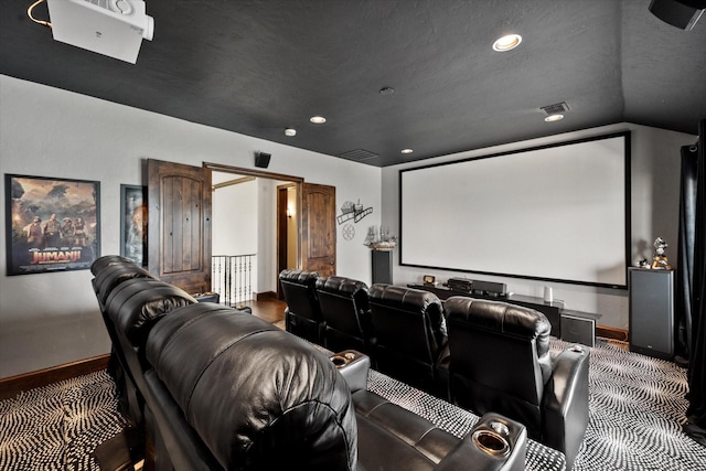 home theater room with baseboards, visible vents, and recessed lighting