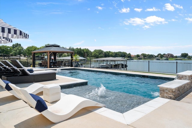 view of pool with a water view, fence, a gazebo, a fenced in pool, and a patio area