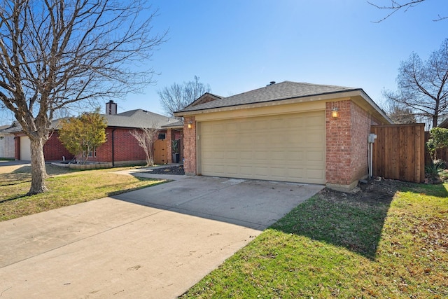 view of front of home with a garage, brick siding, driveway, and a front lawn