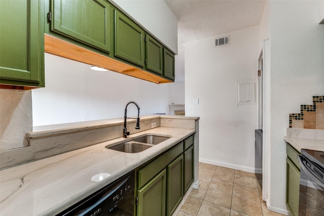 kitchen featuring black appliances, visible vents, green cabinets, and a sink