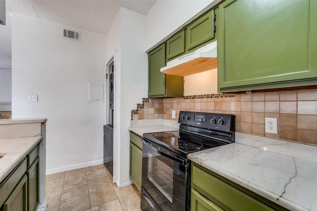 kitchen with tasteful backsplash, visible vents, black / electric stove, under cabinet range hood, and green cabinets