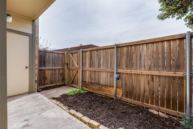 view of yard with a gate and fence