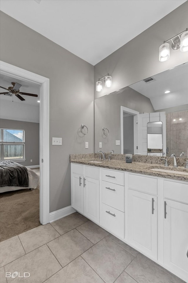 ensuite bathroom featuring ensuite bathroom, a sink, visible vents, a ceiling fan, and double vanity