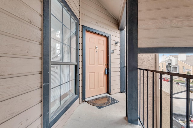 entrance to property with a balcony