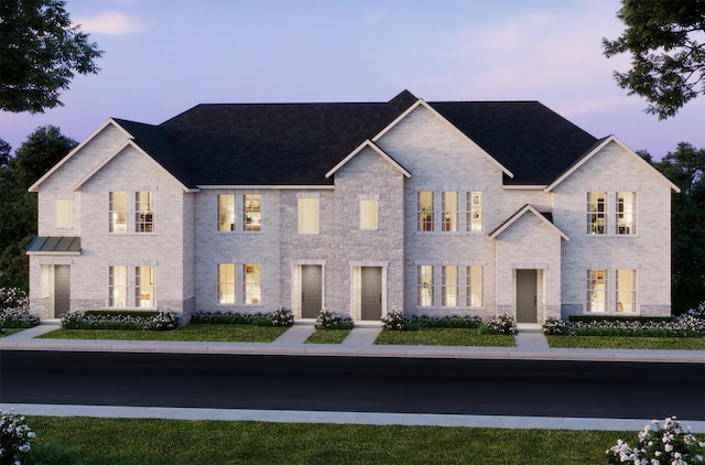 view of front of house featuring brick siding