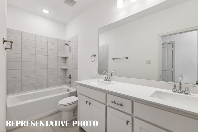 full bathroom featuring double vanity, tub / shower combination, a sink, and visible vents